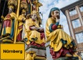 City Sign Nuremberg german `Nuernberg` in Front of golden Beautiful Fountain