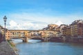 Famous Ponte Vecchio Bridge, medieval stone bridge over the Arno River in Florence, Tuscany, Italy. Major landmark of the Italian Royalty Free Stock Photo