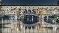 Famous Ponte Vecchio bridge timelapse over the Arno river in Florence, Italy, lit up at night Royalty Free Stock Photo