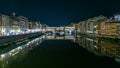 Famous Ponte Vecchio bridge timelapse over the Arno river in Florence, Italy, lit up at night Royalty Free Stock Photo