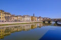 The famous Ponte Vecchio, the Old Bridge and city houses with reflections in the Arno River, Florence, Tuscany, Italy Royalty Free Stock Photo