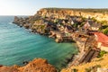 Famous Popeye Village in Anchor Bay, Mellieha, Malta. Turquoise sea water and blue sky Royalty Free Stock Photo