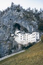 Famous Predjama castle in the mountain, build inside the rock, Slovenia