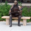 famous president sitting on cement bench bench