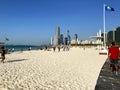 Famous public Corniche beach with many people.