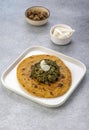 Cornmeal breads and  mustard leaves curry, famous Indian food specially prepared in winters, makki ki roti - sarson ka saag Royalty Free Stock Photo