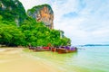The famous Railay beach at Krabi, Thailand. Long tailed boats are prepared for passengers near limestone rock. Tropical paradise, Royalty Free Stock Photo