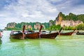 The famous Railay beach at Krabi, Thailand. Long tailed boats are prepared for passengers near limestone rock. Tropical paradise, Royalty Free Stock Photo