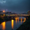 The famous Rainbow Bridge over Keelung River with reflections in the water at blue dusk, in Taipei, Taiwan, Royalty Free Stock Photo