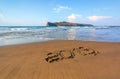 Famous resort of Crete island, Greece. Sand beach seascape with the rays of the sun. 2019 writing on the surface. Beautiful sea