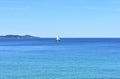 Bay with blue sea and sailing boat on a sunny day. Sanxenxo, Rias Baixas, Pontevedra, Spain.