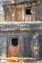 Famous rock-cut Lycian tombs in Kas resort of Antalya. Royalty Free Stock Photo