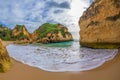 Famous rock formation in a bay on the beach of Tres Irmaos in Alvor, PortimÃÂ£o, Algarve, Portugal, Europe. Royalty Free Stock Photo