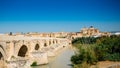 Famous Roman bridge of Cordoba, Spain across Guadalquivir River Royalty Free Stock Photo