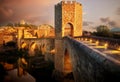 Famous Romanesque Bridge in BesalÃÂº, Catalonia, Spain during sunset