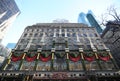 Famous Saks Fifth Avenue flagship store with holiday window display in Manhattan