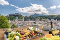 Salzburg city with gastronomic experience of typical Austrian food and wine against downtown in Austria