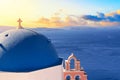 Famous Santorini iconic view. Church of St. Anastasi during sunset. Oia village, Santorini island, Greece