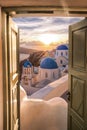 Santorini view with churches against colorful sunset in Oia village, Greece