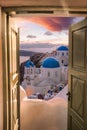 Santorini view with churches against colorful sunset in Oia village, Greece Royalty Free Stock Photo
