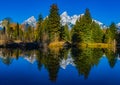 Beautiful Snow Mountain Reflecting on Perfectly Calm Lake Royalty Free Stock Photo