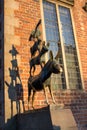 Famous sculpture of Bremen musicians on sunny day. Bronze monument of fairytale animals. Heritage of Grimm brothers.