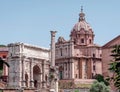 The famous Septimius Severus triumph arch in front of St. Luca and Martina church Domus at the Roman Forum. Royalty Free Stock Photo