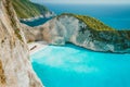 Famous shipwreck on Navagio beach with turquoise blue sea water surrounded by huge white cliffs. Famous landmark Royalty Free Stock Photo
