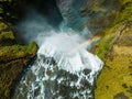 Famous Skogafoss waterfall with a rainbow. Dramatic Scenery of Iceland during sunset.