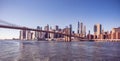 Famous Skyline of downtown New York City, Brooklin Bridge and Manhattan with skyscrapers illuminated over East River panorama. New Royalty Free Stock Photo