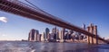 Famous Skyline of downtown New York City, Brooklin Bridge and Manhattan with skyscrapers illuminated over East River panorama. New Royalty Free Stock Photo