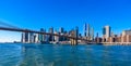 Famous Skyline of downtown New York City, Brooklin Bridge and Manhattan with skyscrapers illuminated over East River panorama. New Royalty Free Stock Photo