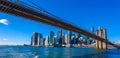 Famous Skyline of downtown New York City, Brooklin Bridge and Manhattan with skyscrapers illuminated over East River panorama. New Royalty Free Stock Photo