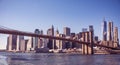 Famous Skyline of downtown New York City, Brooklin Bridge and Manhattan with skyscrapers illuminated over East River panorama. New Royalty Free Stock Photo