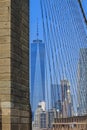 Skyline of downtown New York and Lower Manhattan in New York City, USA seen through the cables of the Brooklyn Bridge Royalty Free Stock Photo