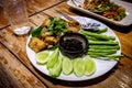 Thai-braised pork belly served with fresh cucumber and yardlong beans