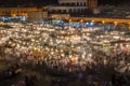 Famous square Jemaa El Fna busy with many people and lights during the night, medina of Marrakesh, Morocco Royalty Free Stock Photo
