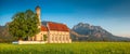 Famous St. Coloman church near Fussen at sunset, Bavaria, Germany Royalty Free Stock Photo