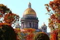 Famous St. Isaac Cathedral on autumn day. Green trees and golden domes of cathedral on a sunny day. Saint Petersburg. Russia Royalty Free Stock Photo