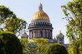 Famous St. Isaac Cathedral on summer day. Green trees and golden domes of cathedral on a sunny day. Saint Petersburg. Russia Royalty Free Stock Photo