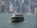 A Star Ferry sails across Victoria Harbour in Hong Kong Royalty Free Stock Photo