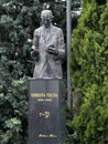Defaced granite stone statue of Tesla in outdoor park in Belgrade, Serbia. Royalty Free Stock Photo
