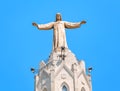 Statue of Jesus Christ with open handed on top of the Church of the Sacred Heart on Tibidabo in Barcelona, Spain Royalty Free Stock Photo