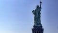 The famous Statue of Liberty of the Big Apple and Manhattan seen from the back, a monument known as the lady of New York. Royalty Free Stock Photo