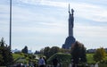 The famous statue of the Motherland against the blue sky. Sights and monuments of Kyiv. Monumental sculpture in Kyiv on the right