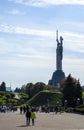 The famous statue of the Motherland against the blue sky. Sights and monuments of Kyiv. Monumental sculpture in Kyiv on the right