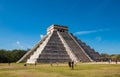 Famous pyramid against blue sky at ancient Mayan ruins of Chichen Itza in Mexico Royalty Free Stock Photo