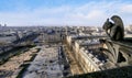 Famous Stone Gargoyle Statue In Notre Dame Cathedral With City Of Paris Royalty Free Stock Photo