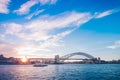 Famous sunset over Sydney Harbour Bridge. Stunning view of the waterfront near the Opera house. Royalty Free Stock Photo