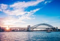 Famous sunset over Sydney Harbour Bridge. Stunning view of the waterfront near the Opera house. Royalty Free Stock Photo